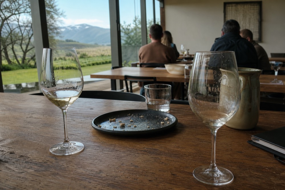 Close-up of wine glasses with pale Riesling on a tasting room table, no text, no logos, no people