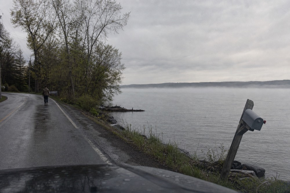Morning light on a lakeshore road running along Seneca Lake, no text, no logos, no people